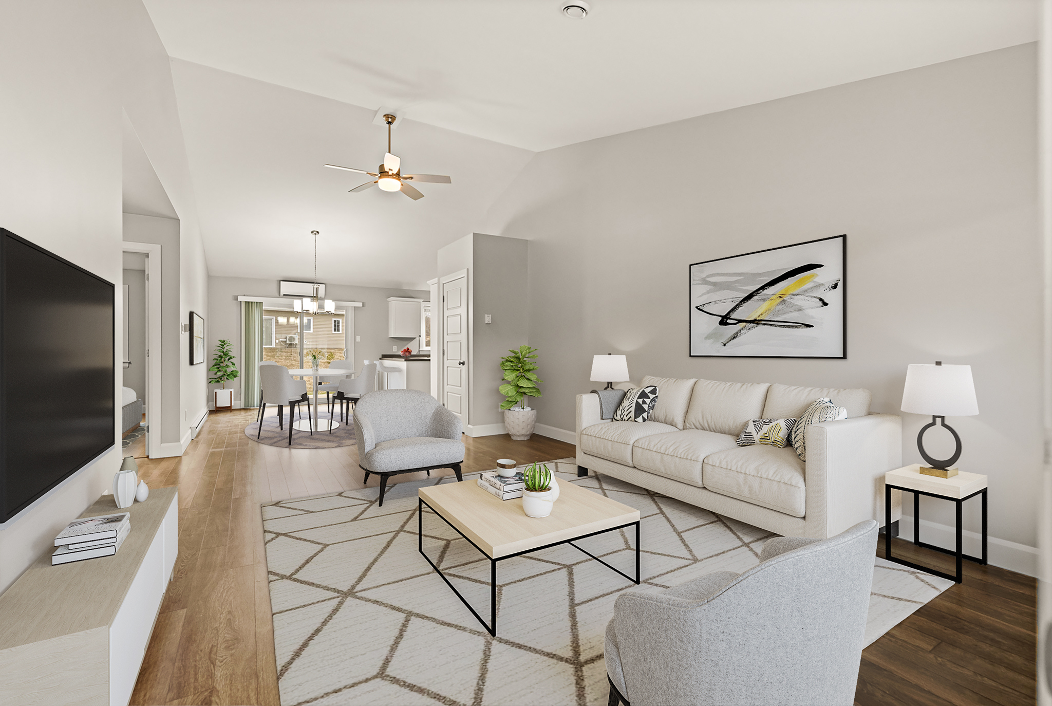 Bright living and dining area with vaulted ceiling